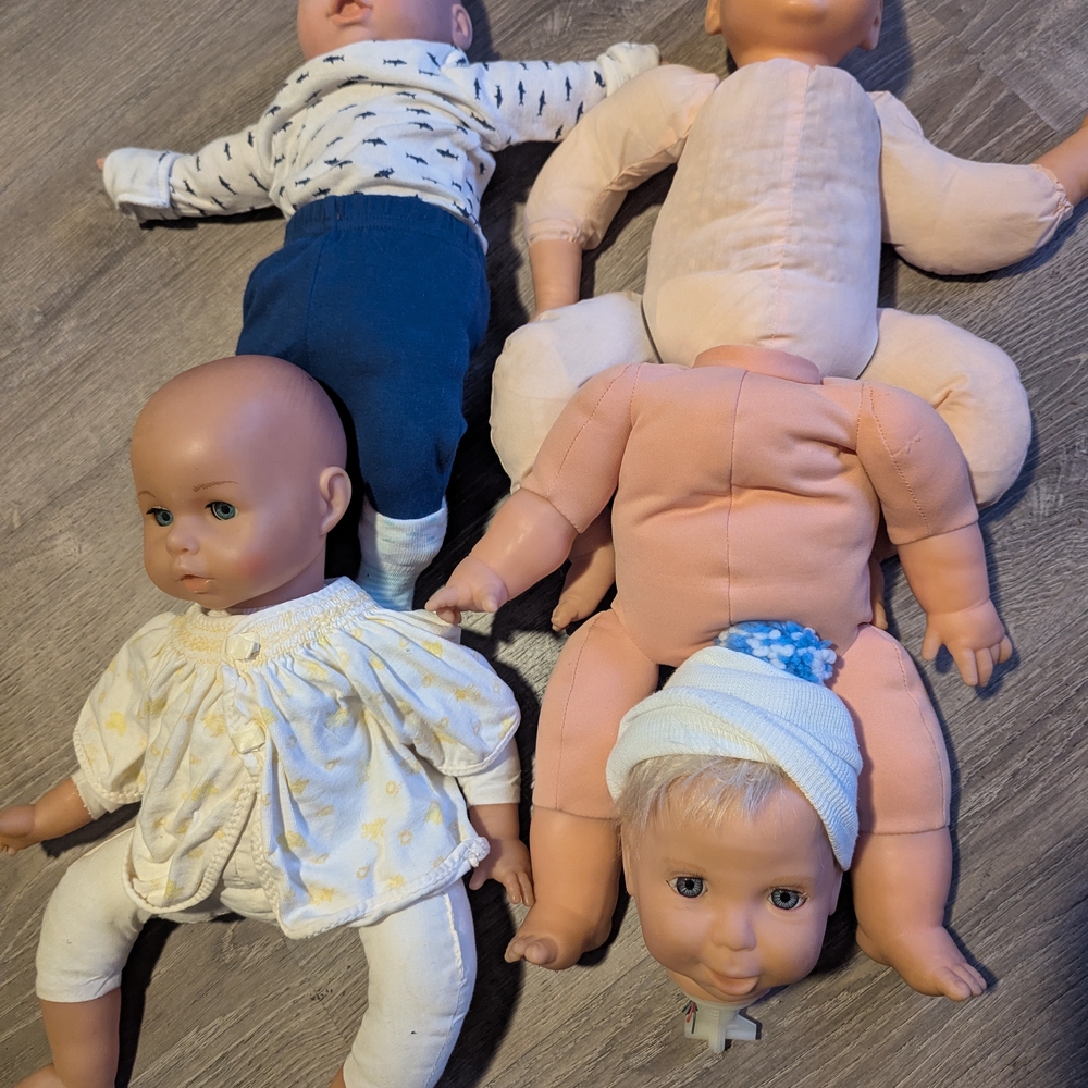 Assorted Baby Dolls - Blue, Cream, and Peach Plush & Vinyl Dolls